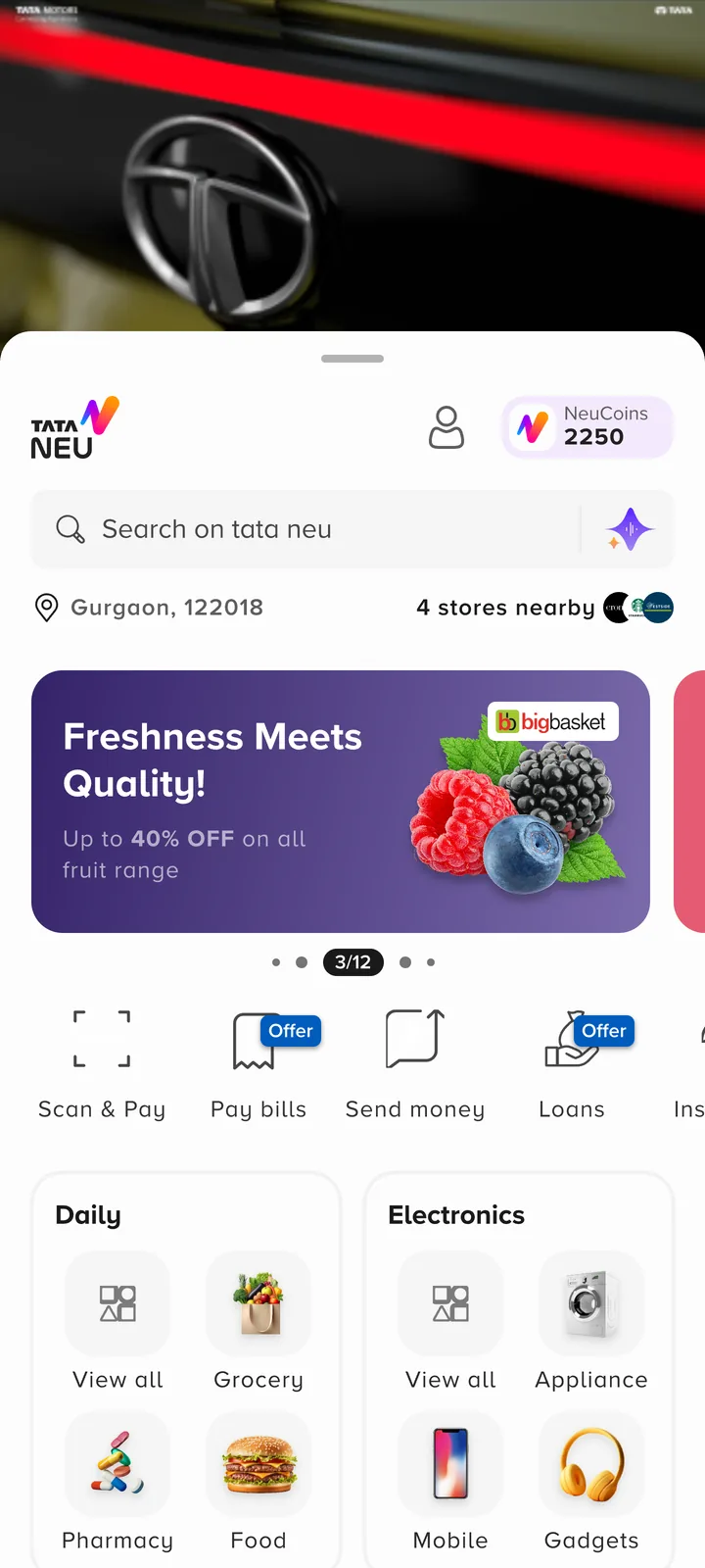 The 2024 Tata Neu homepage: a car video banner, search, a BigBasket offer banner, payment actions and category cards.